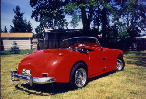 Here are some pictures of my Allard Palm Beach, s/n 21Z 5119. Note that the grill on my car is the correct buffed aluminum panels rather than the painted ones on the example you have pictured. Engine